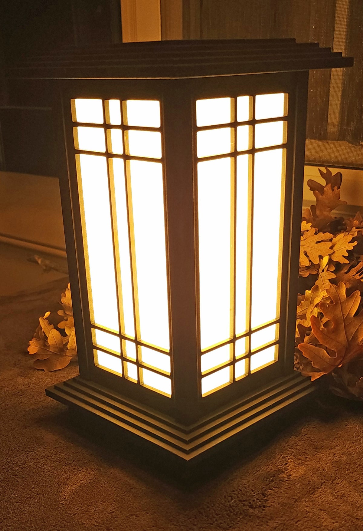 Rich Ebony Kyoto shoji-style lamp illuminated with warm LED light