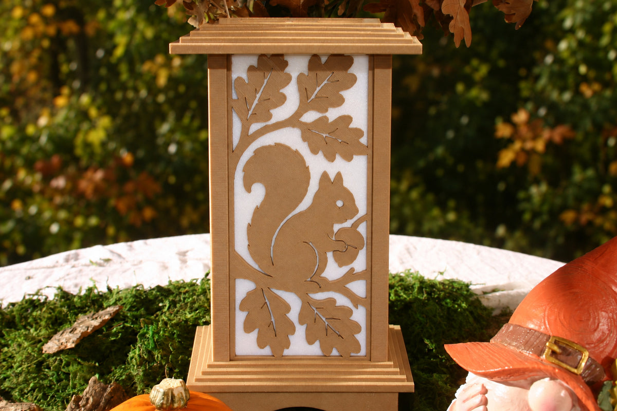Squirrel and Acorn interchangeable autumn wall panel displayed on a Kyoto Lamp